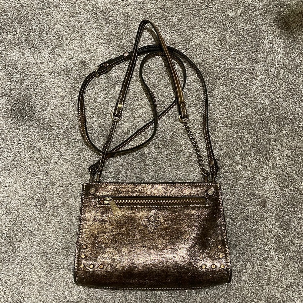Patricia Nash gold-tone bag.